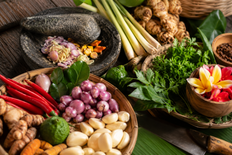 Fresh Balinese spices herbs and cooking ingredients arranged on a table